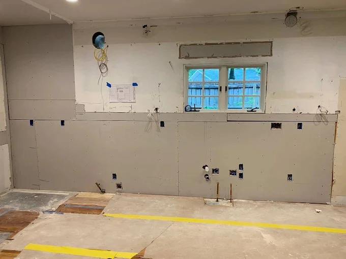 Apartment kitchen stripped to framing during a multifamily renovation
