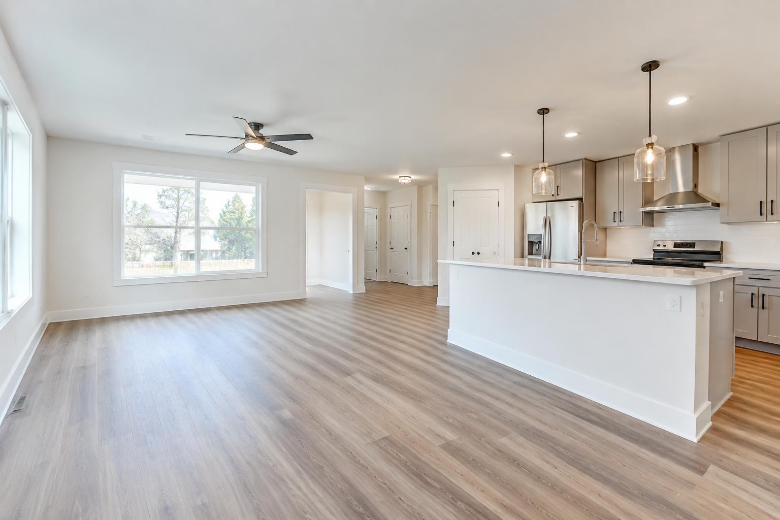 Freshly renovated apartment unit interior with new flooring, paint, and finishes